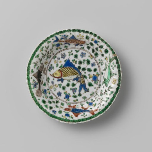 Saucer with fish between water plants