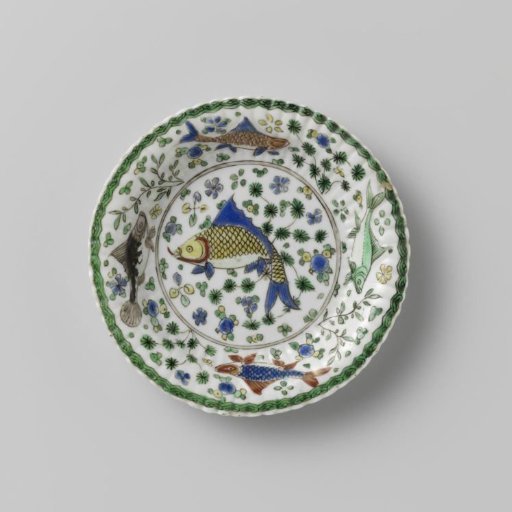 Cup and saucer with fish between water plants