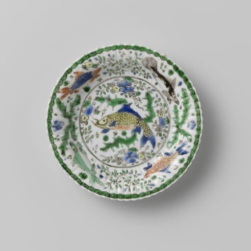 Cup and saucer with fish between water plants