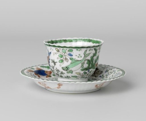 Cup and saucer with fish between water plants