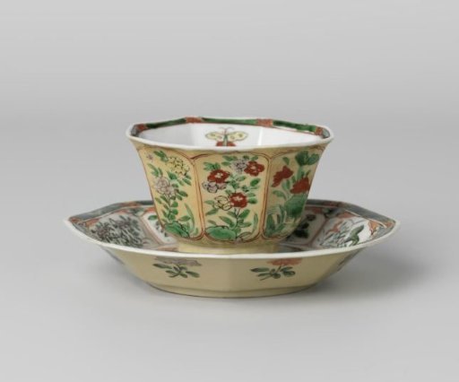 Octagonal cup and saucer with light brown, animals and flower sprays