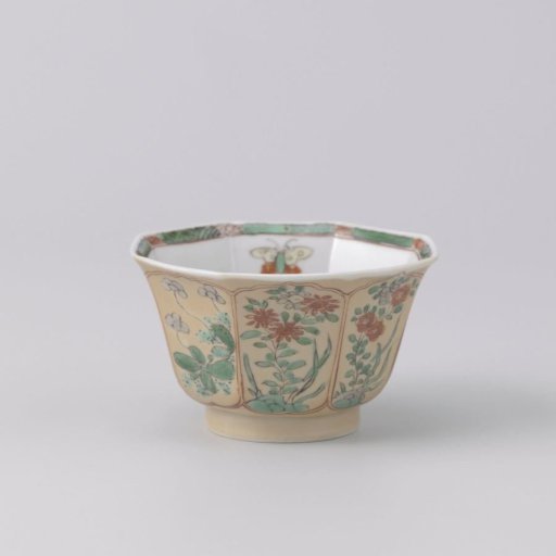 Octagonal cup with light brown, animals and flower sprays