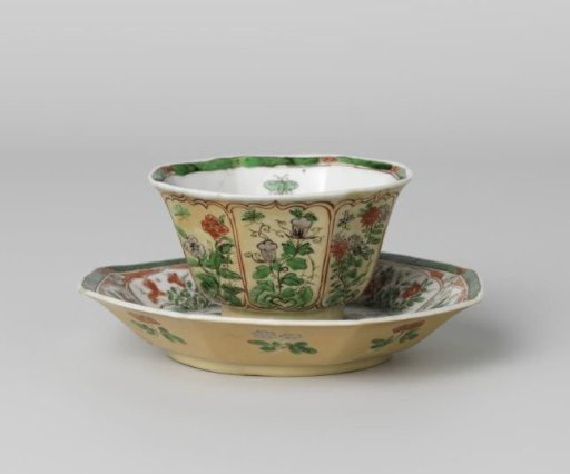 Octagonal cup and saucer with light brown, animals and flower sprays