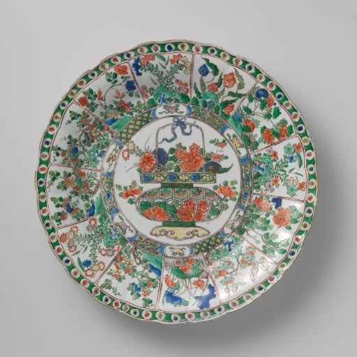 Dish with flower basket, precious objects and flowering plants