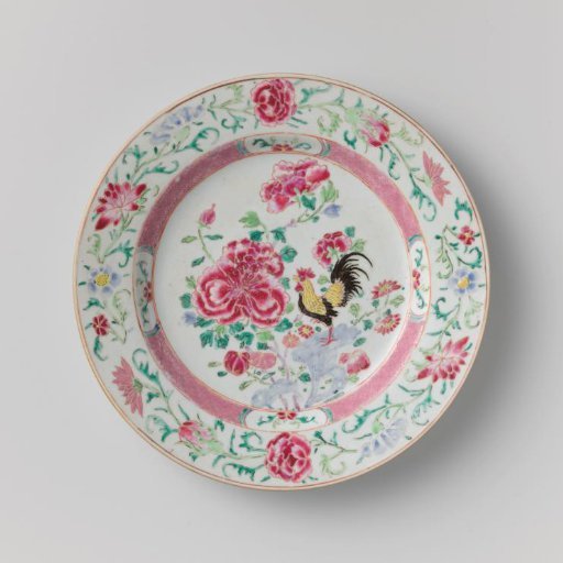 Plate with a cock on a rock near flowering plants
