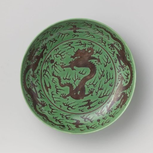 Saucer-dish with pearl chasing dragons against a green ground