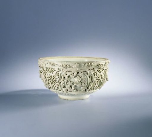 Bowl with pierced sides and moulded flower sprays and floral scrolls
