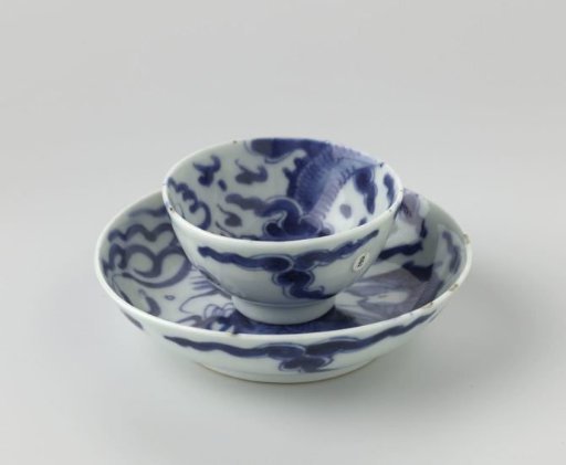 Cup and saucer with a pearl chasing dragon