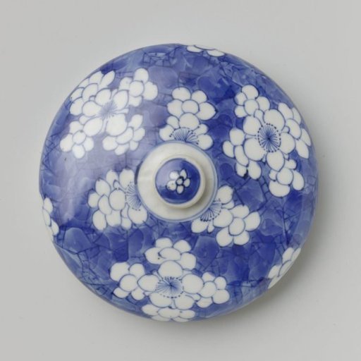Cylindrical covered jar with flower-heads in reserve