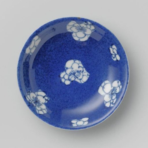 Saucer-dish with powder blue and flower heads in reserve