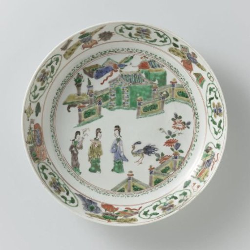 Saucer-dish with three women and a peacock in a fenced garden in front of a pavilion