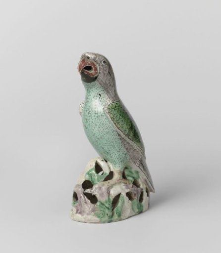 Figure of a parrot on a rock
