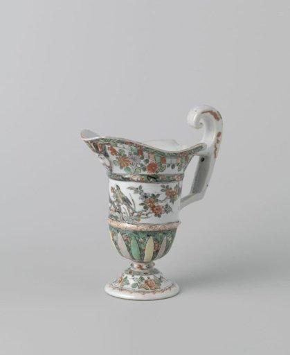 Helmet-shaped ewer with a face, animals and flower sprays