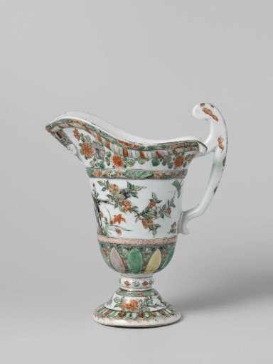 Helmet-shaped ewer with a face, animals and flower sprays