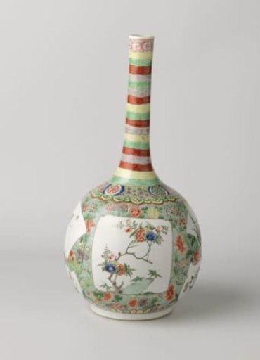 Bottle vase with flower sprays in cartouches in reserve on a speckled green ground