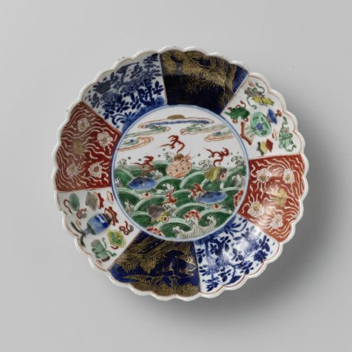 Saucer-dish with fluted sides and flowers and shellfish above waves