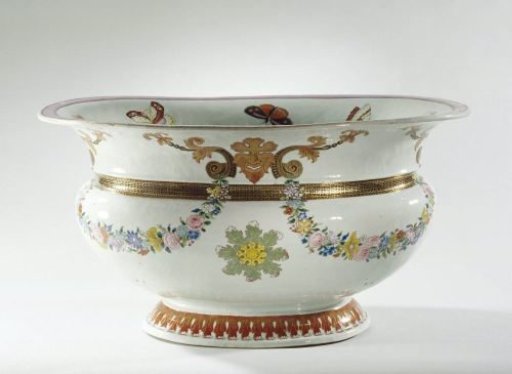 Oval basin with masks and garlands