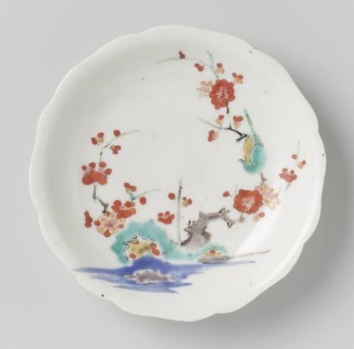 Scalloped saucer with rocks, prunus and bird