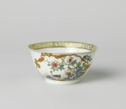 Bell-shaped cup with a crane near a peony plant and rock