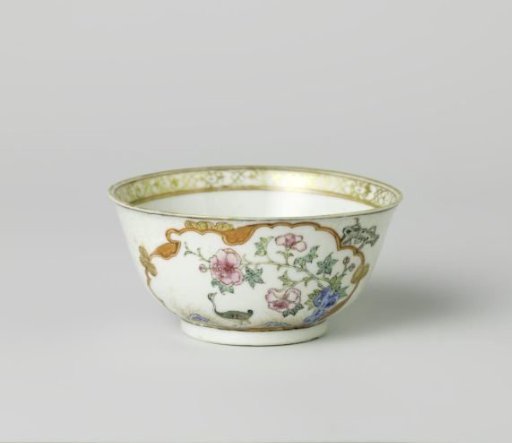 Bell-shaped cup with a crane near a peony plant and rock