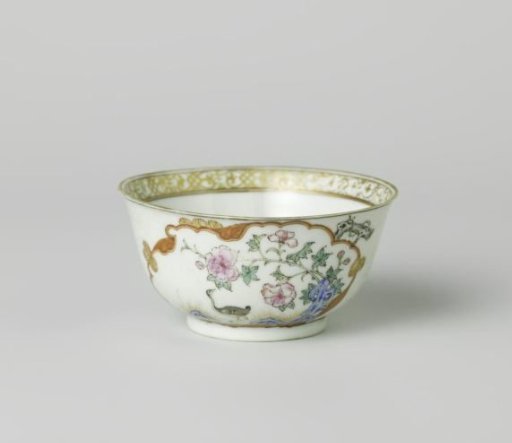 Bell-shaped cup with a crane near a peony plant and rock