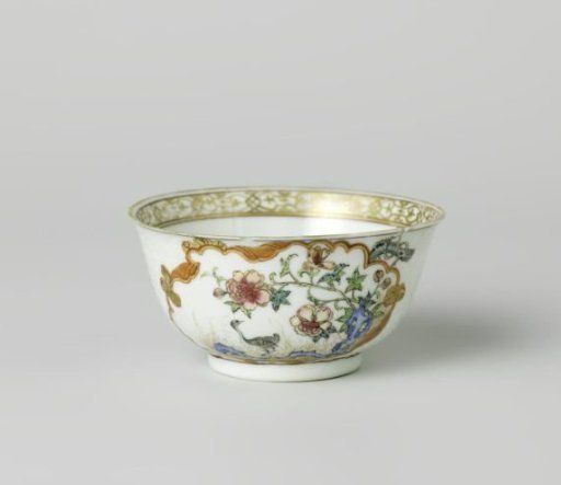 Bell-shaped cup with a crane near a peony plant and rock