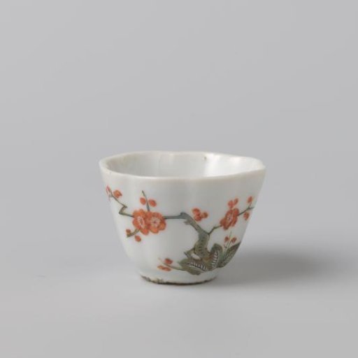 Cup with fluted sides, a prunus spray and a flying bird