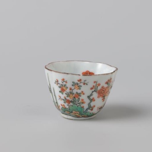 Cup with fluted sides and flowering plants