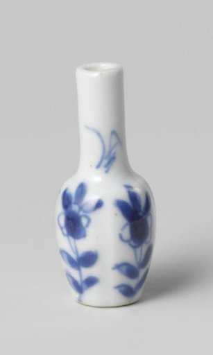 Miniature bottle vase with flowering plants