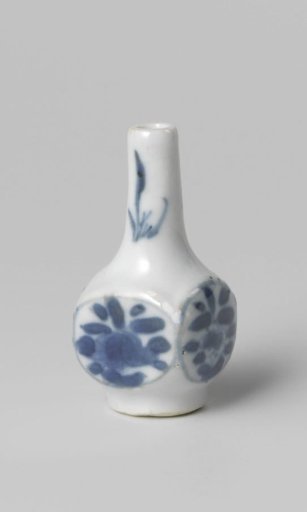 Miniature bottle vase with flowering plants