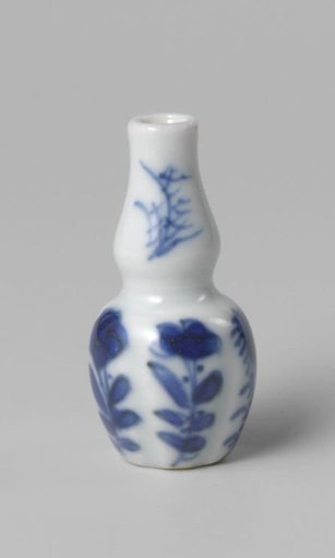 Miniature bottle vase with flowering plants