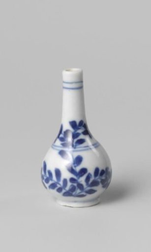 Miniature bottle vase with a flowering plant