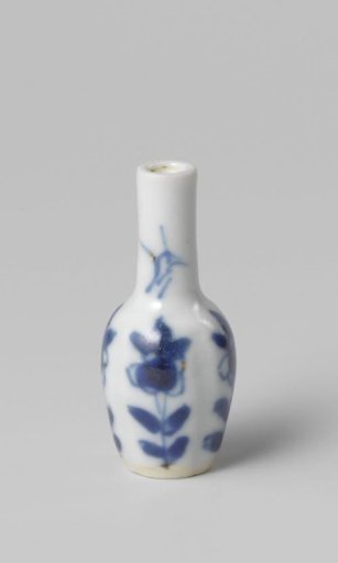 Miniature bottle vase with flowering plants