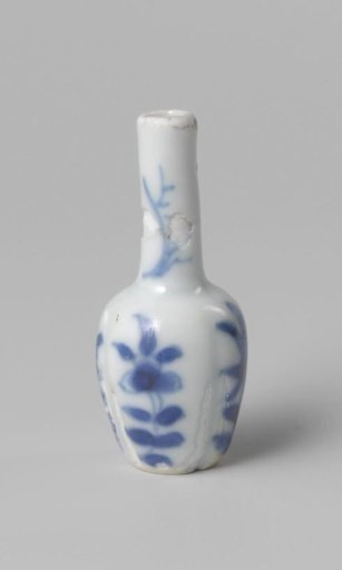 Miniature bottle vase with flowering plants