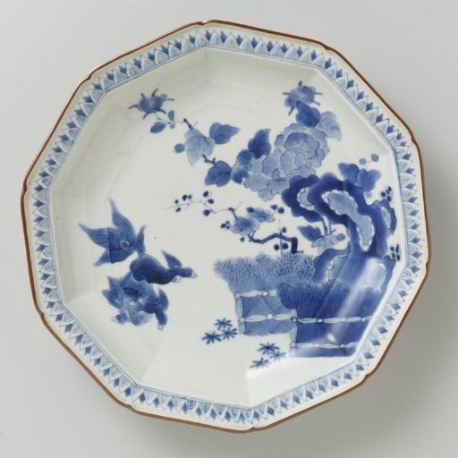 Decagonal dish with a shishi near flowering trees, rocks and brushwood fences