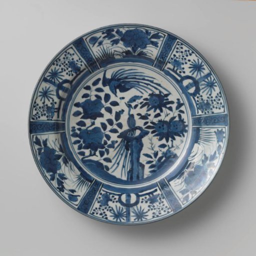 Dish with two hoo-birds near rocks and flowering plants