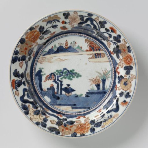 Dish with a water landscape, flowering plants and flower sprays