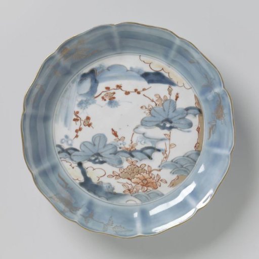 Saucer-dish with flowering plants and rocks