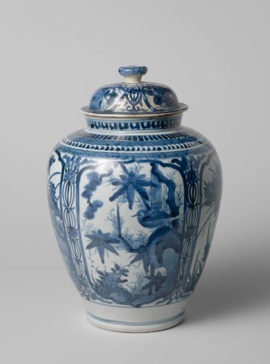 Ovoid covered jar with a bird on a rock and flowering plants in panels