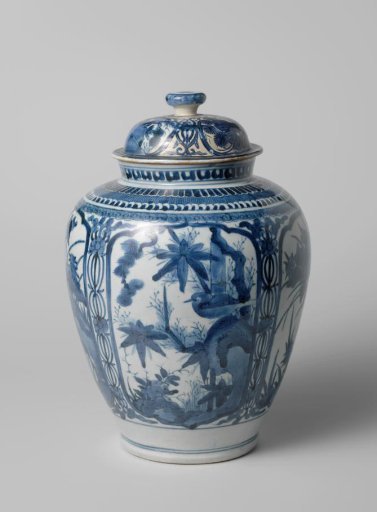Ovoid covered jar with a bird on a rock and flowering plants in panels
