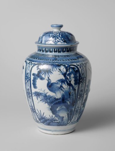 Ovoid covered jar with a bird on a rock and flowering plants in panels
