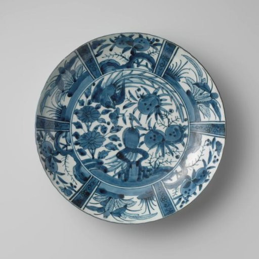 Dish with two hoo-birds near flowering plants