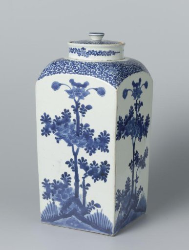 Square bottle with scrolls and flowering trees near rocks