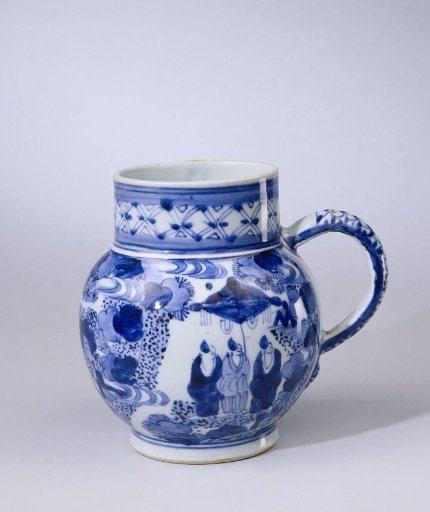 Tankard with figures underneath a parasol in a landscape