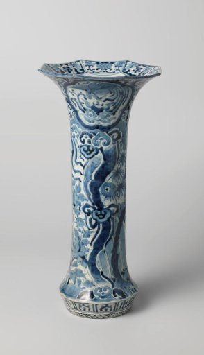 Octagonal beaker vase with a shishi and hoo-bird in a landscape