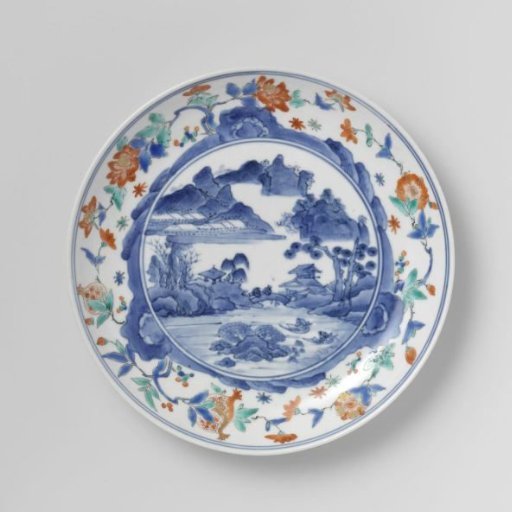 Plate with a water landscape, rocks and flowering plants