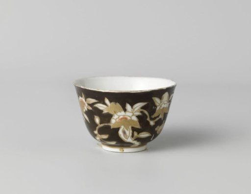 Cup with flower sprays on a black ground