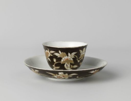 Cup and saucer with flower sprays on a black ground