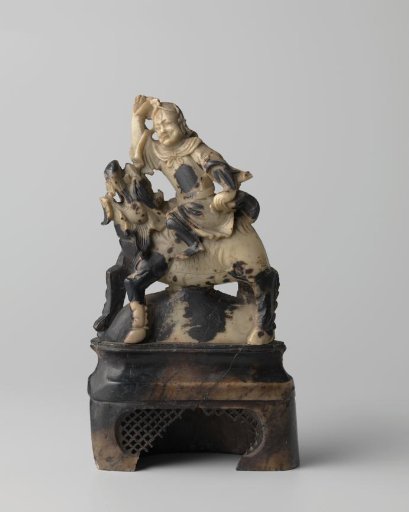 Figurine of a rider on a mythical beast
