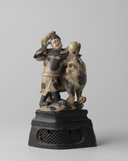 Statue of a man and a Buddhist lion